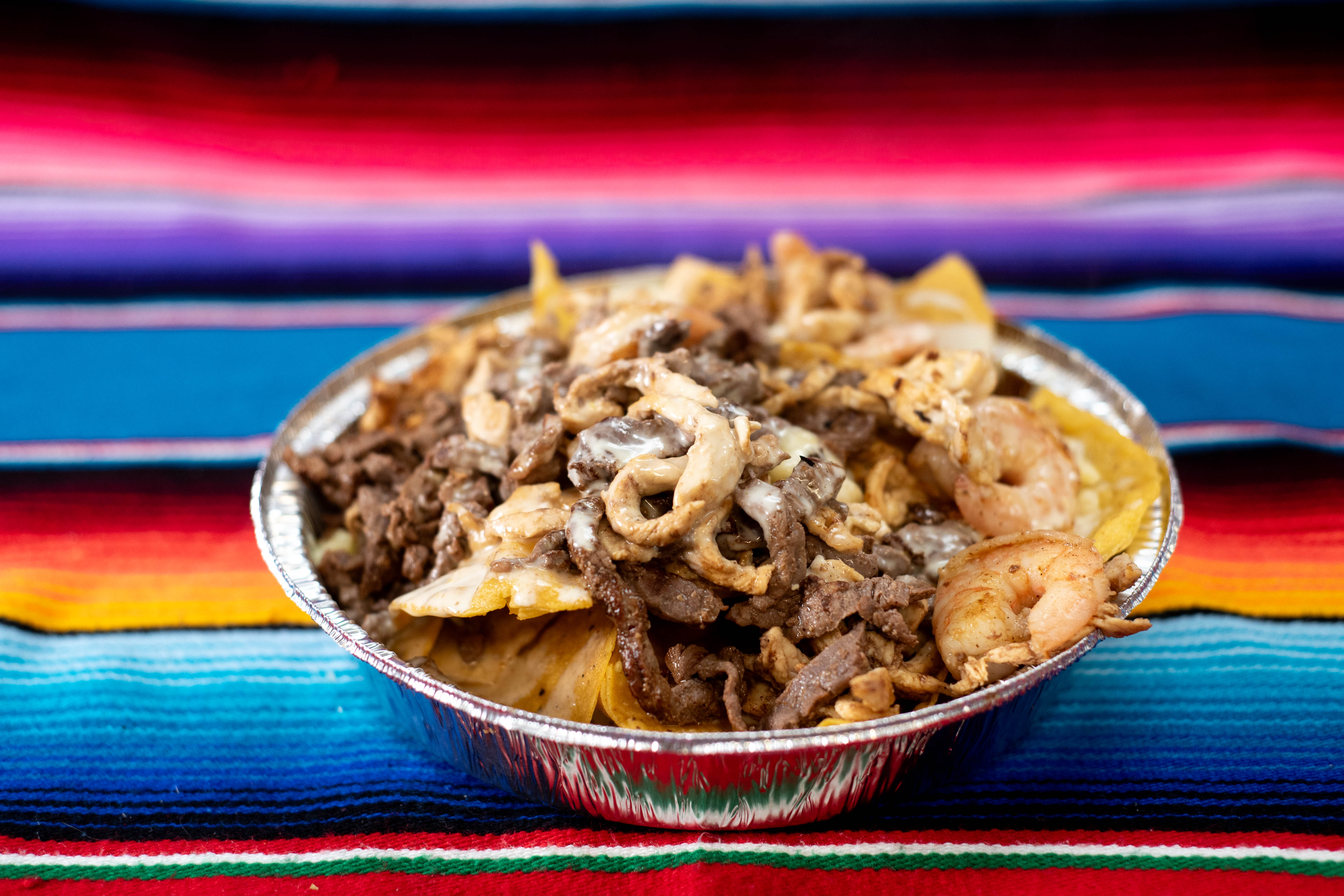 Nachos loaded with meat and cheese